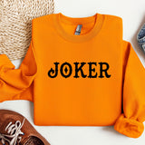 an orange sweater with the word joker printed on it