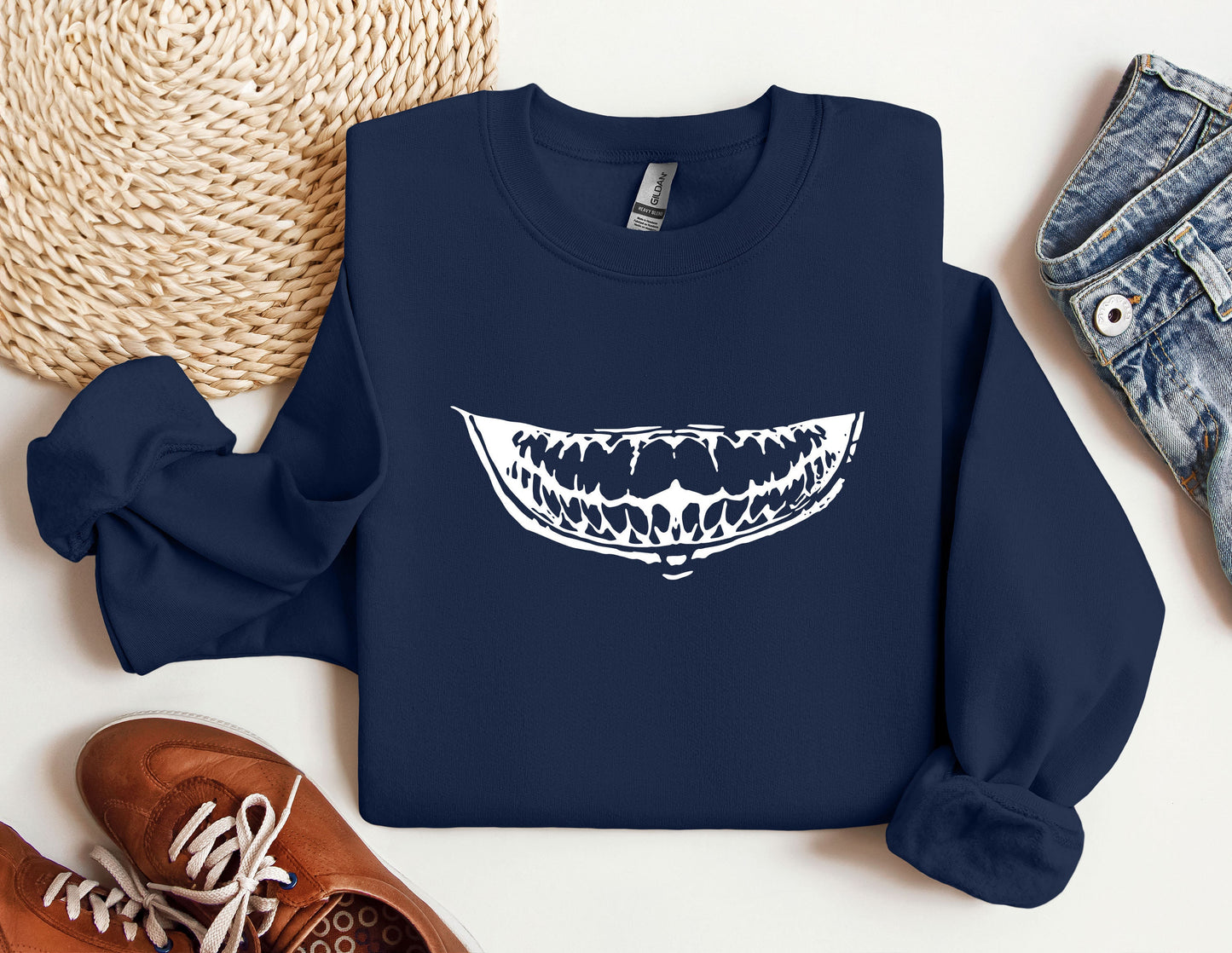 a blue sweatshirt with an image of a mouth on it