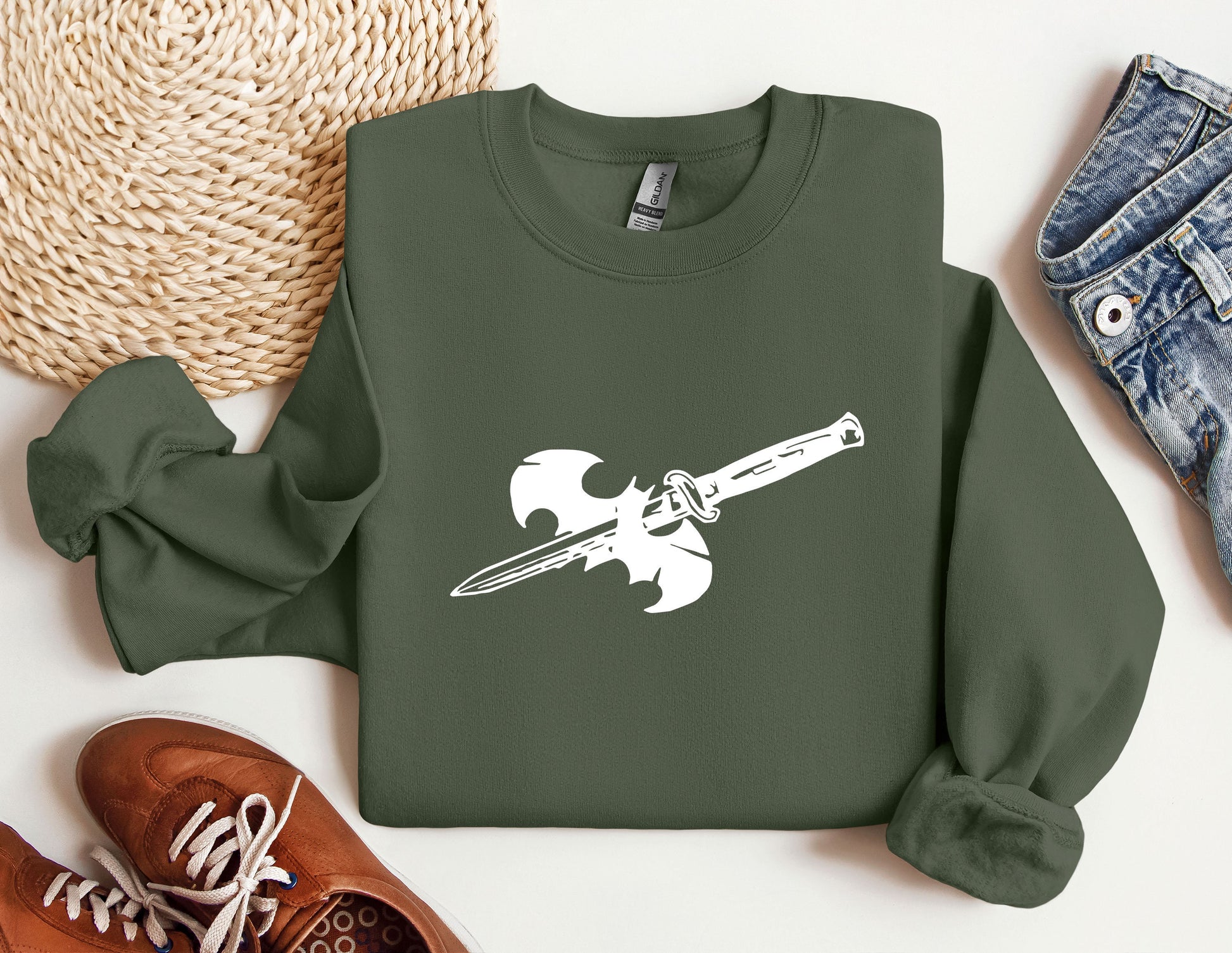 a green sweatshirt with a knife on it