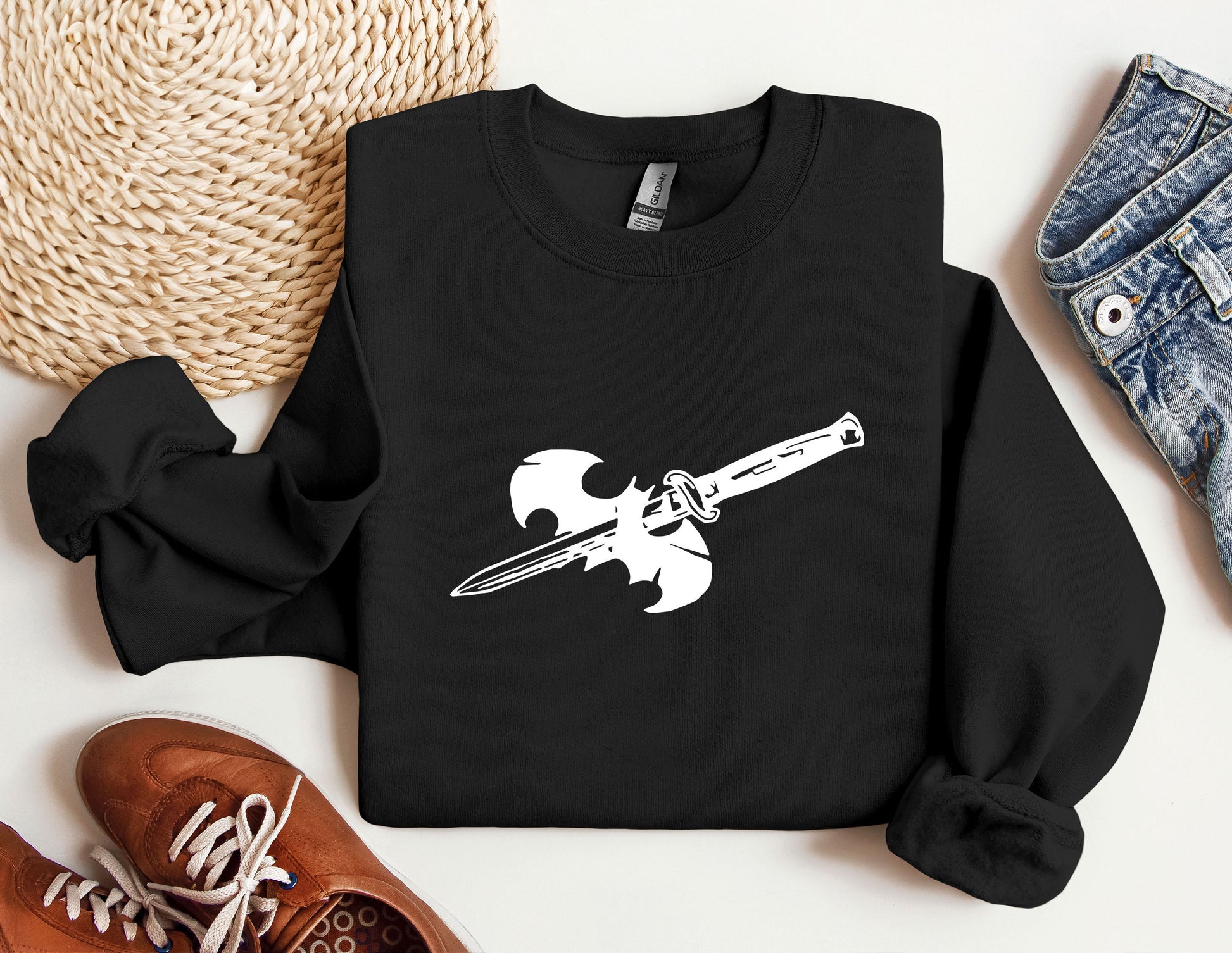 a black sweatshirt with a knife on it