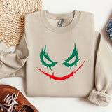 a sweater with a joker face drawn on it