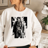 a woman sitting on a bed wearing a white sweatshirt