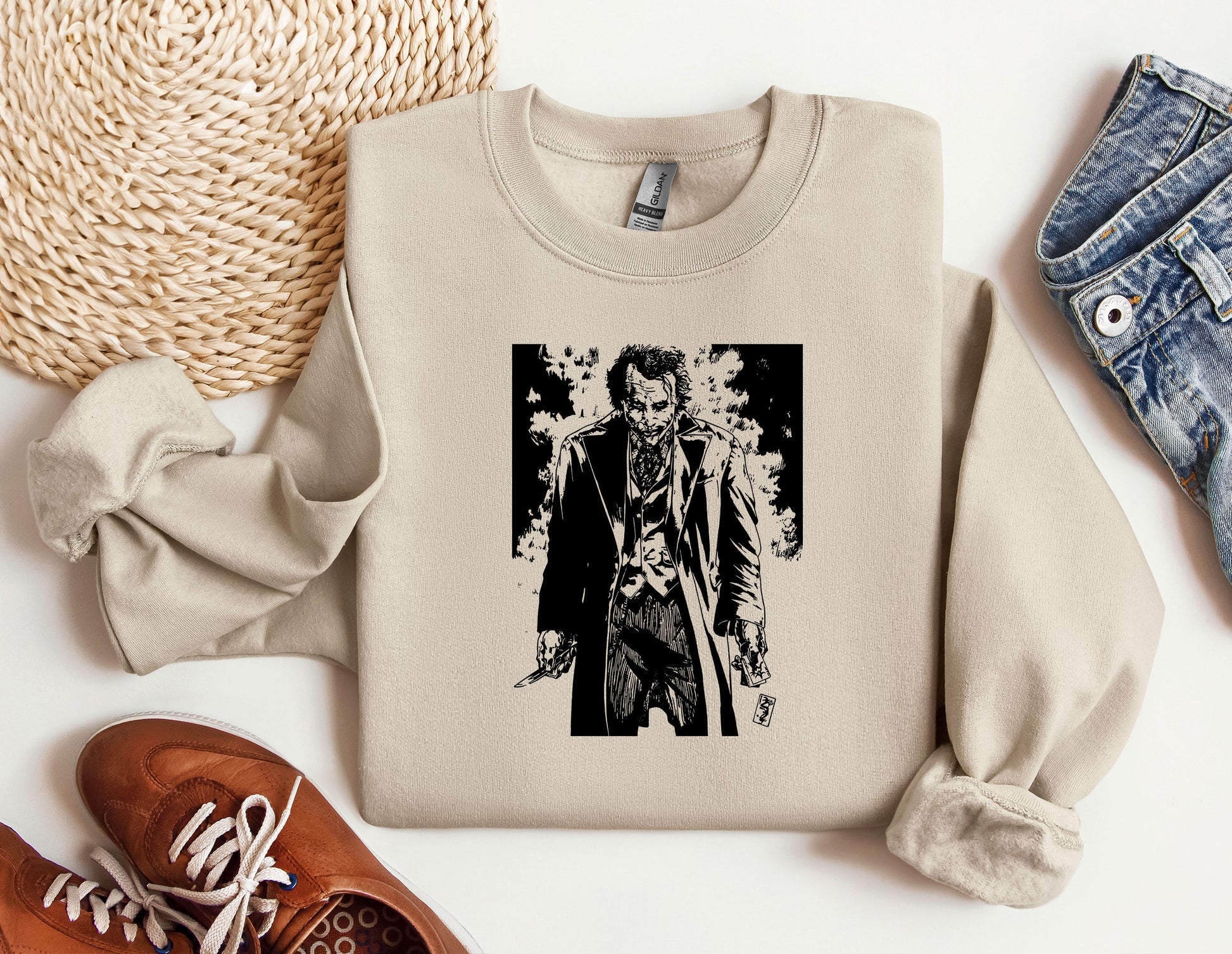 a sweater with a picture of a man holding a knife