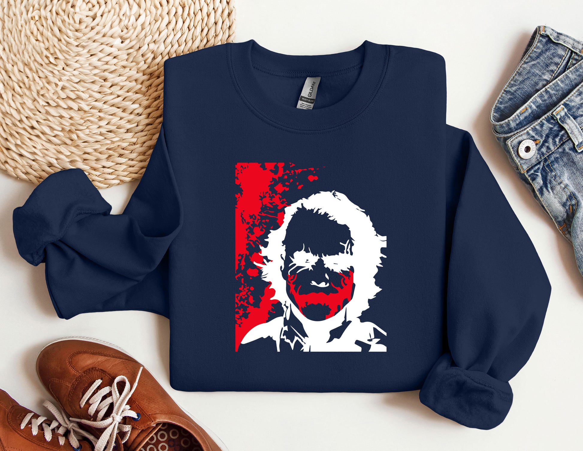 a blue sweater with a picture of a man on it