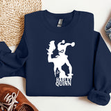 a t - shirt with a picture of a man holding a baseball bat