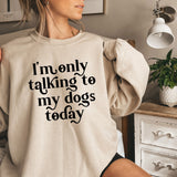a woman wearing a sweatshirt that says i'm only talking to my dogs today