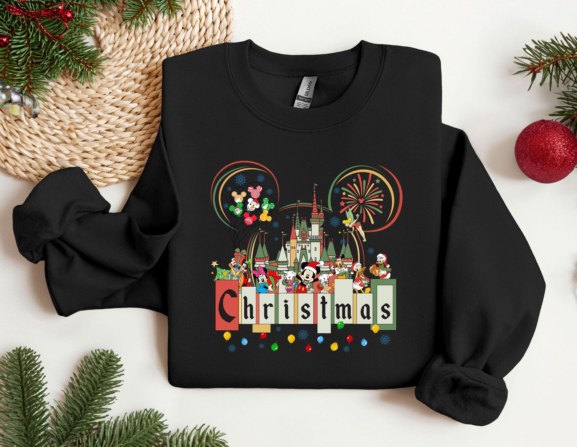 a mickey mouse christmas sweater on a table