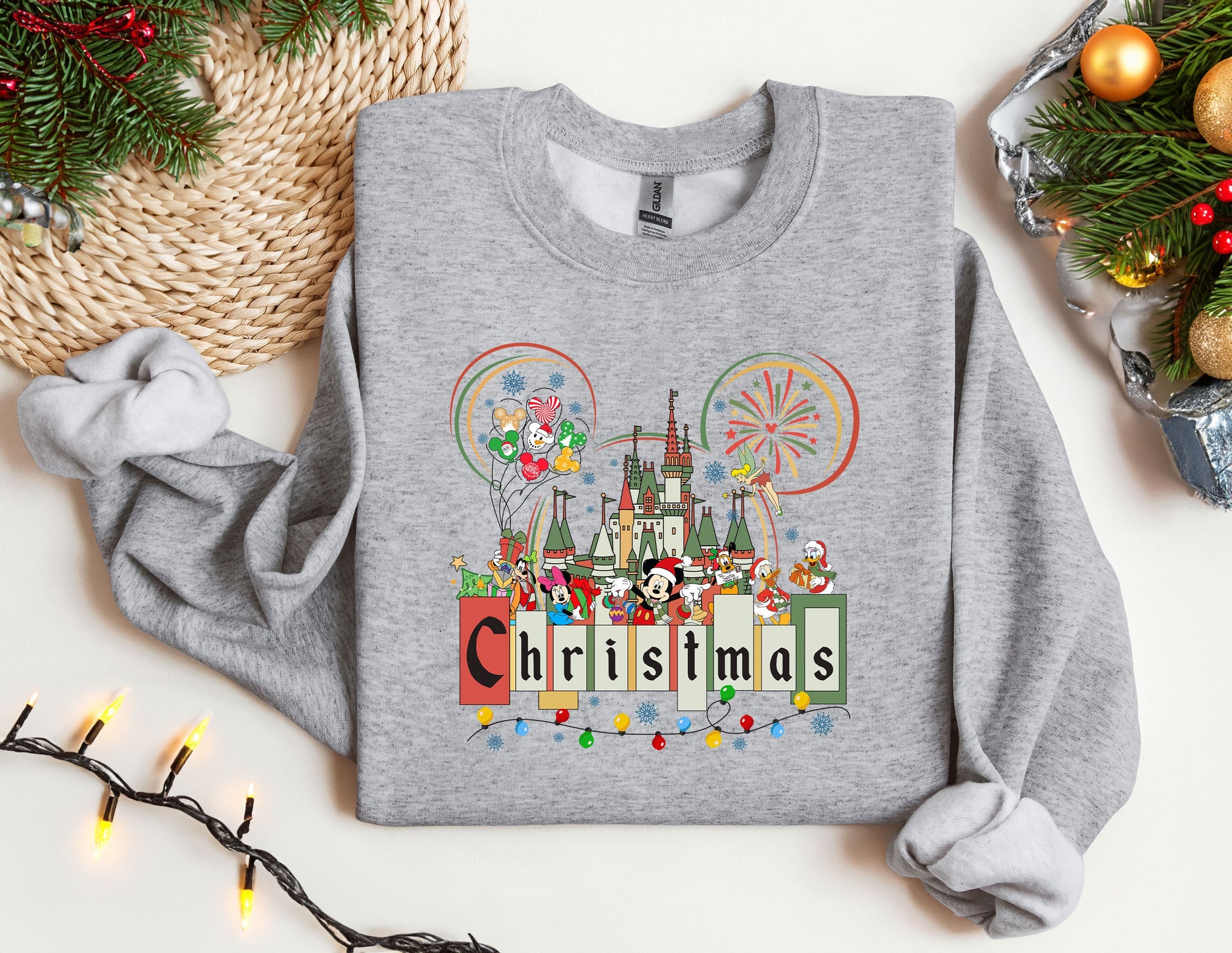 a gray sweatshirt with a mickey mouse christmas sweater on it