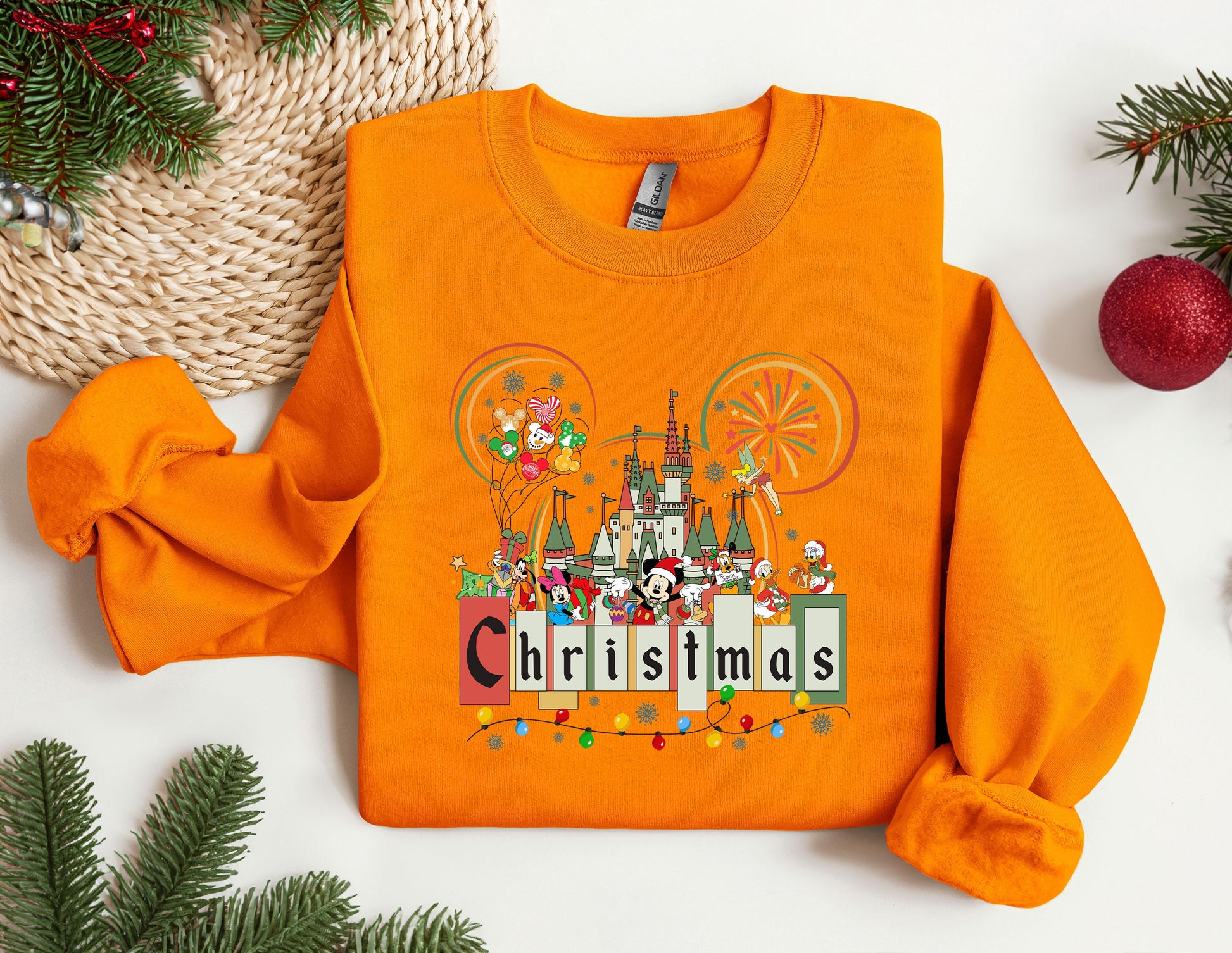 an orange shirt with a castle on it