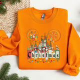an orange shirt with a castle on it