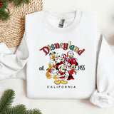 a white sweatshirt with mickey mouse and friends on it