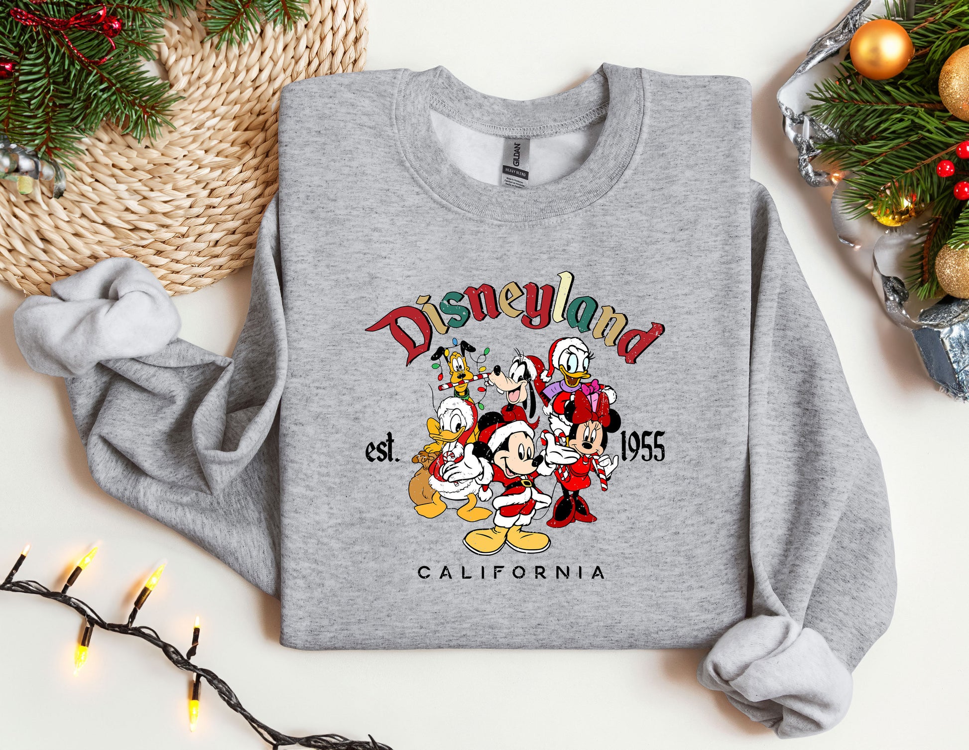 a sweatshirt with a mickey mouse and friends on it