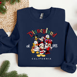 a sweatshirt with a mickey mouse and friends on it