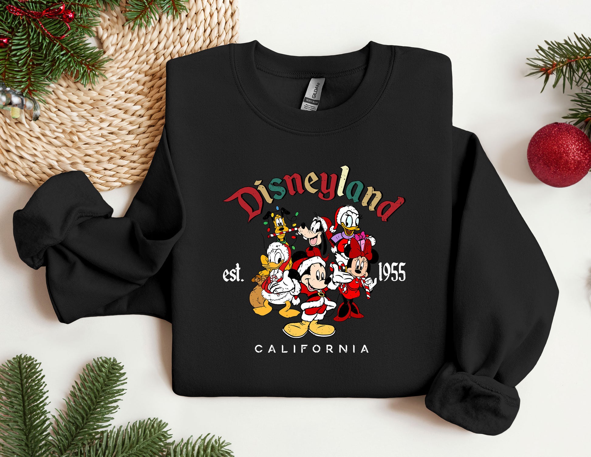 a black sweatshirt with mickey and friends on it