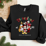a black sweatshirt with mickey and friends on it