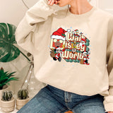 a woman sitting on a chair wearing a sweatshirt