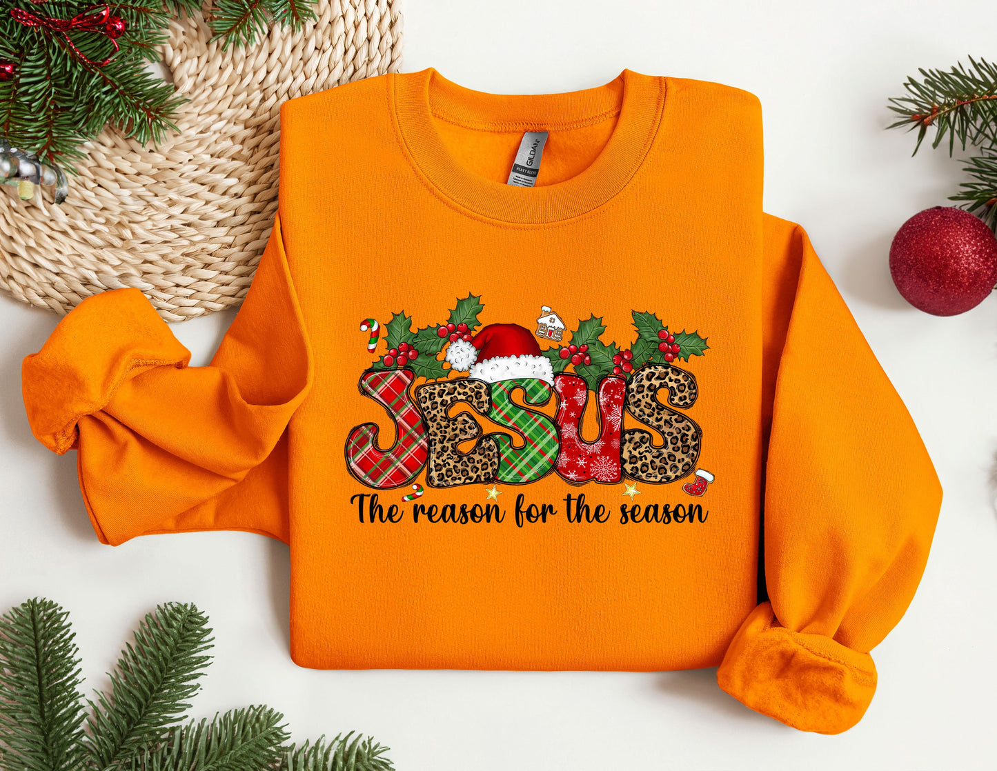 an orange sweatshirt with a christmas design on it