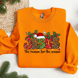 an orange sweatshirt with a christmas design on it