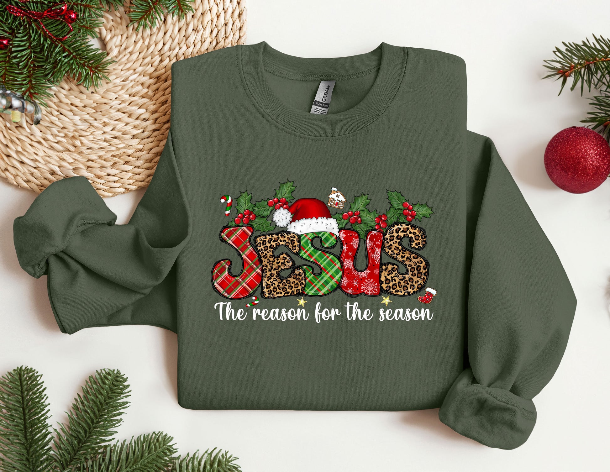 a green sweatshirt with a christmas design on it