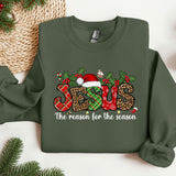 a green sweatshirt with a christmas design on it