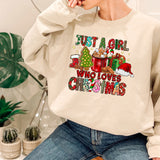 a woman sitting on a chair wearing a sweatshirt that says just a girl who loves