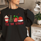 a woman wearing a black shirt that says tis the season