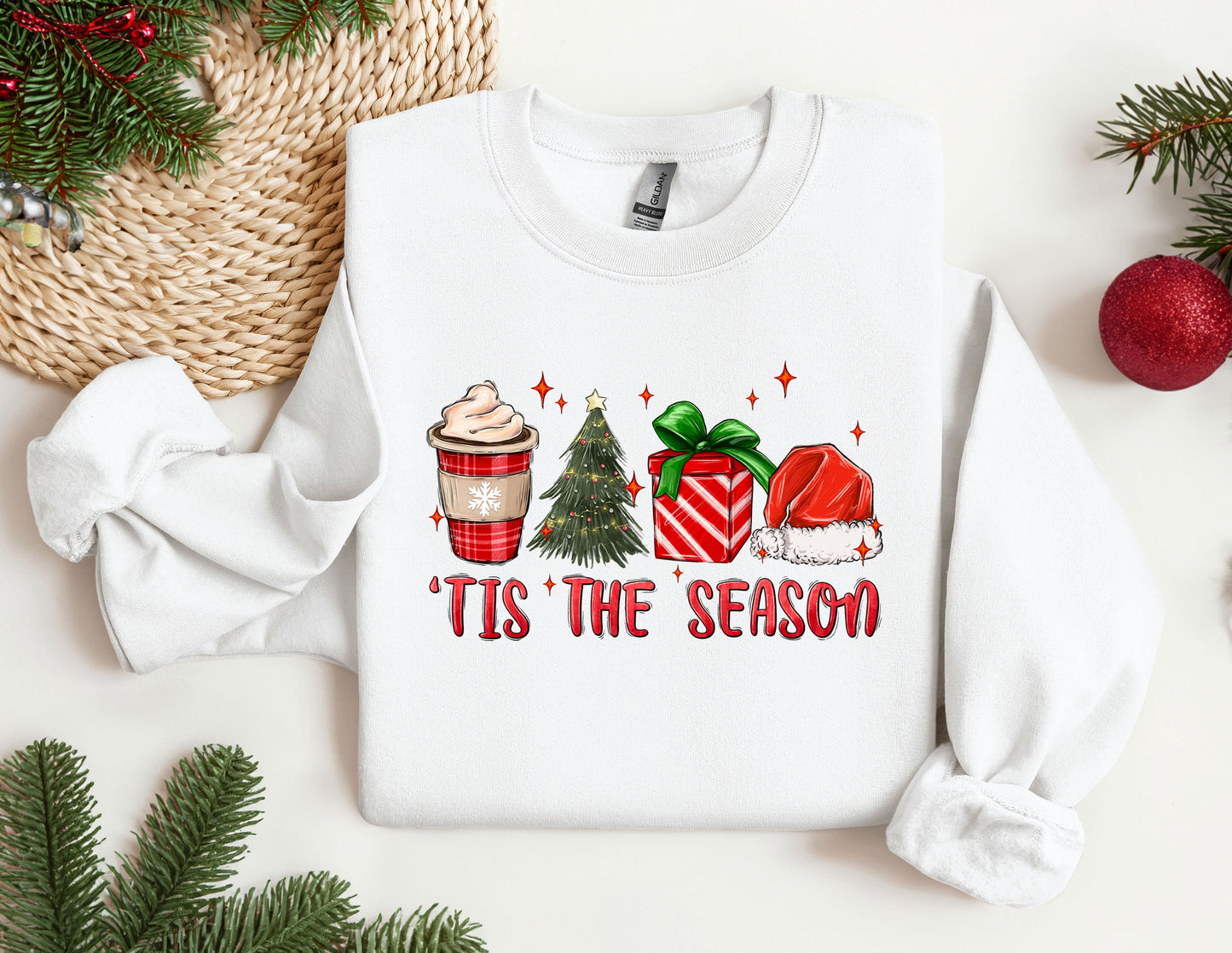 a white sweater with a christmas themed design on it