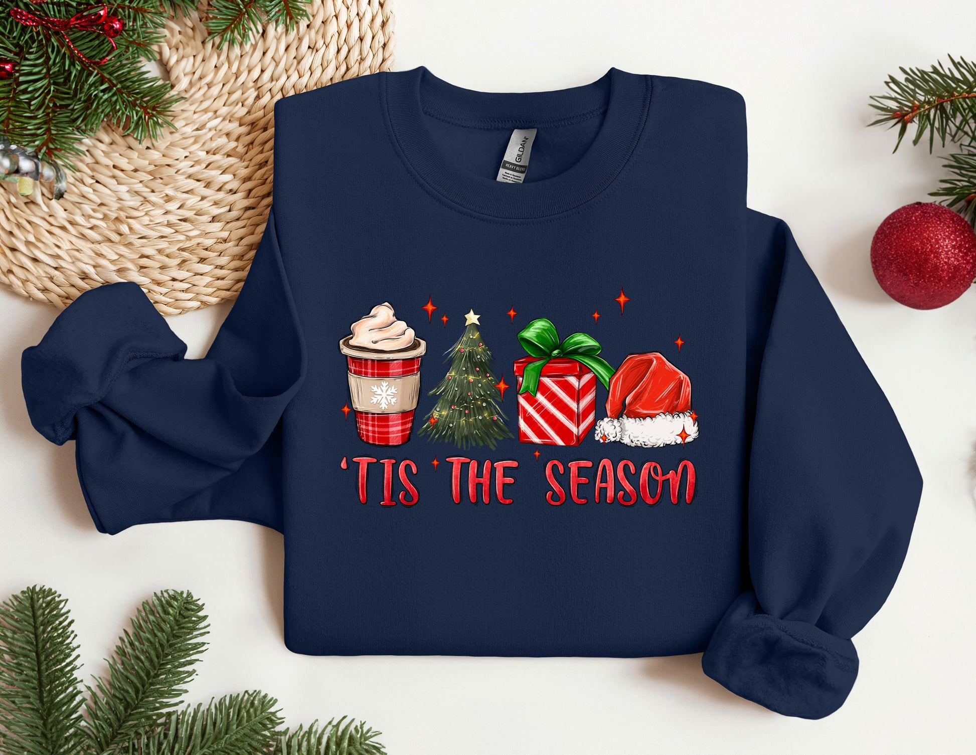 a christmas sweater with a cup of coffee and a christmas tree