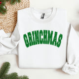 a white sweatshirt with the word grinna's on it