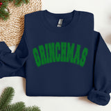 a blue sweatshirt with green lettering on it
