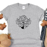 a grey t - shirt with a black and white rose on it