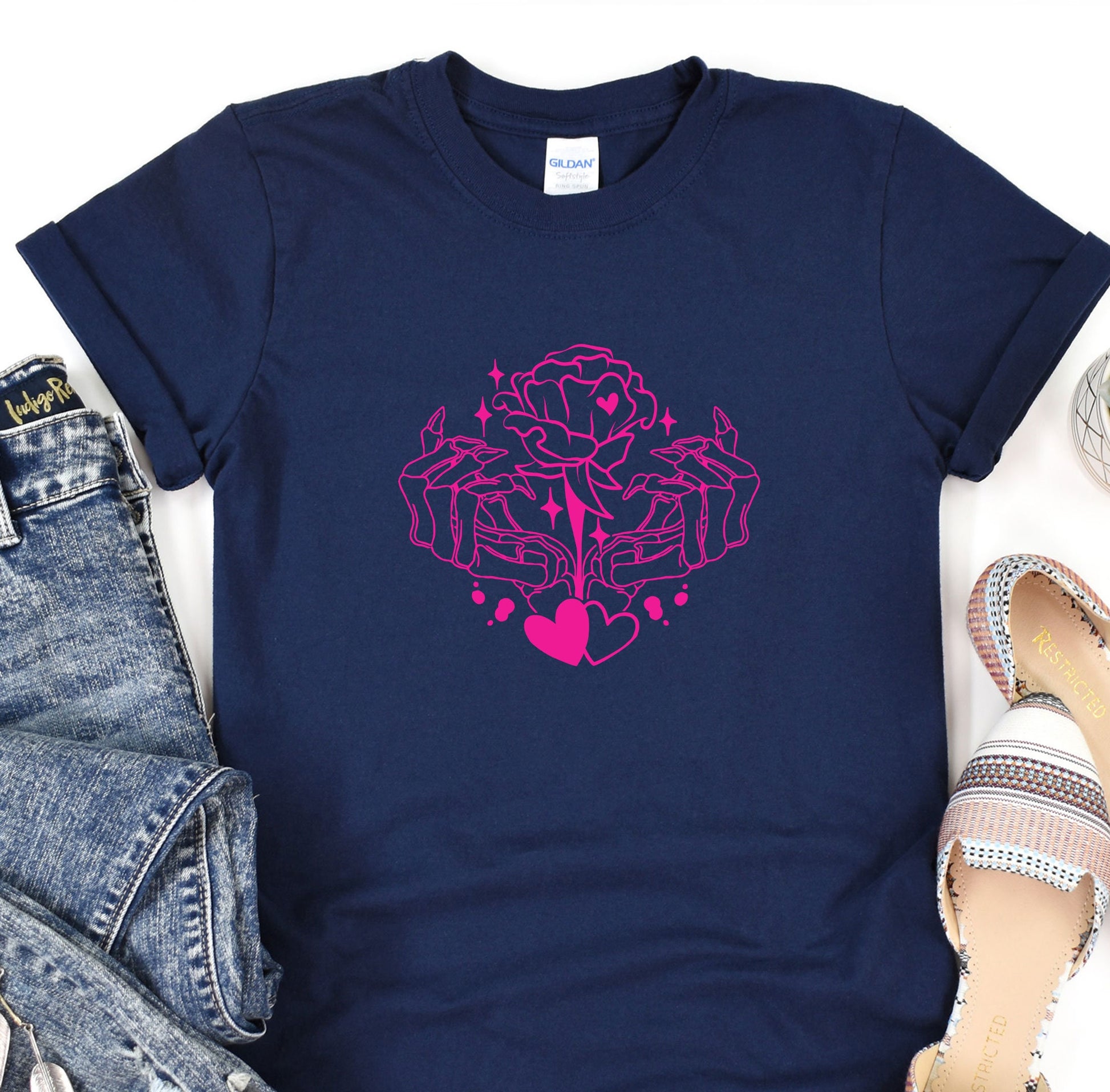 a t - shirt with a pink heart on it