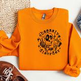 a pair of shoes and an orange shirt with a skeleton on it