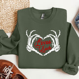 a green sweatshirt with the words love's back printed on it
