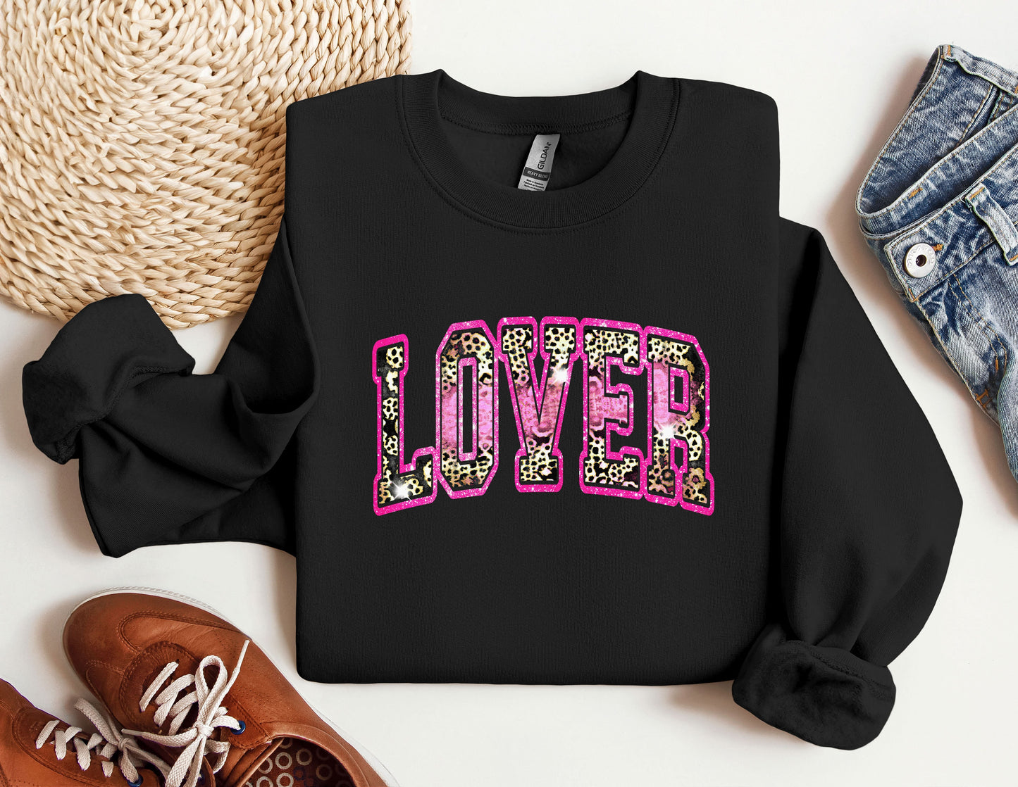 a black sweatshirt with the word love spelled in leopard print