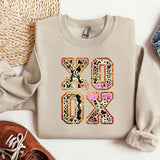 a pair of shoes, a sweater, and a pair of jeans are laid out