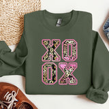 a green sweatshirt with a leopard print on it
