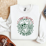a white sweatshirt with a green design on it