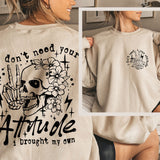 a woman wearing a sweatshirt that says i don't need your attitude