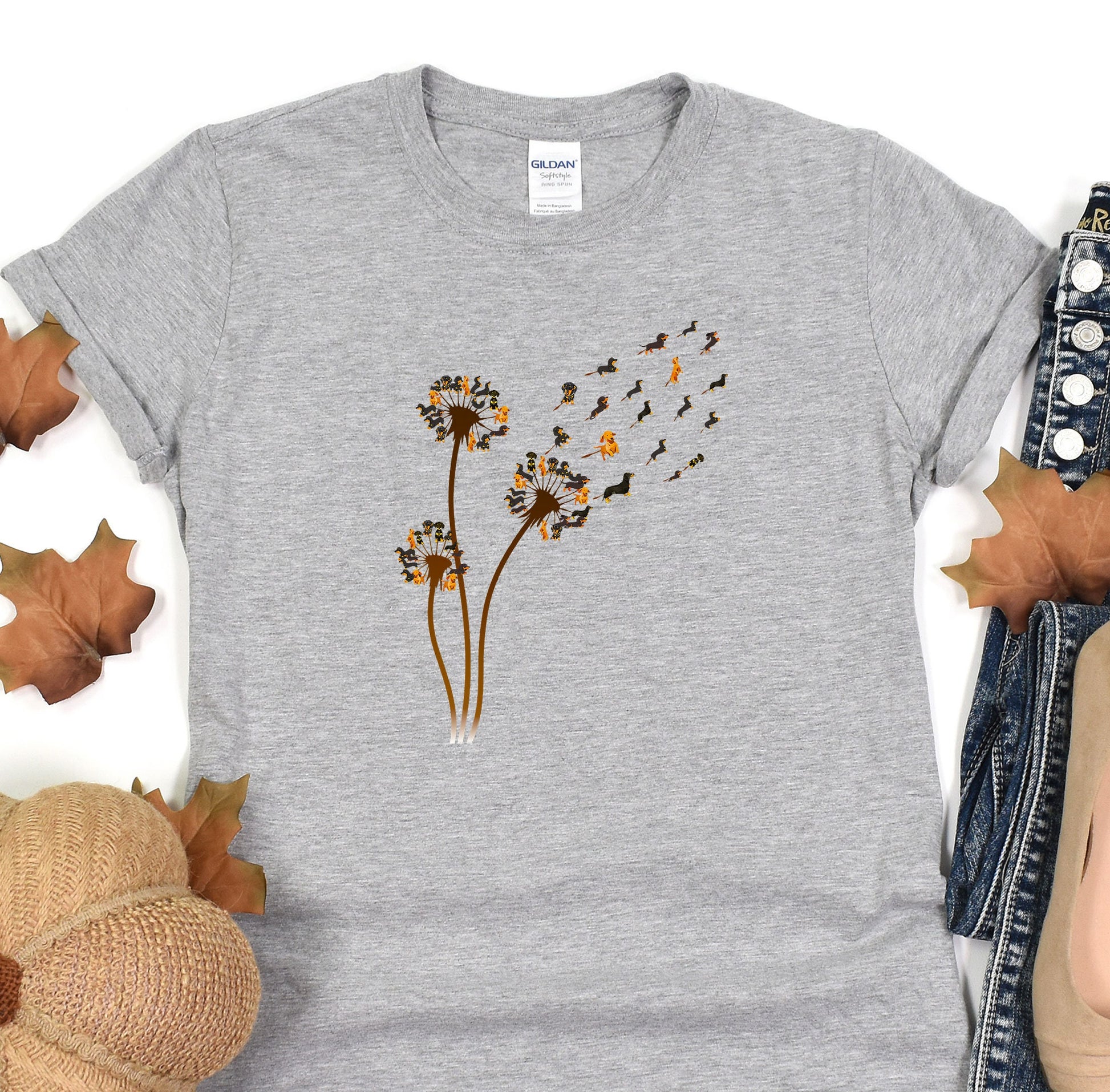 a t - shirt with a dandelion design on it