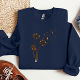 a blue sweatshirt with a picture of a dandelion on it
