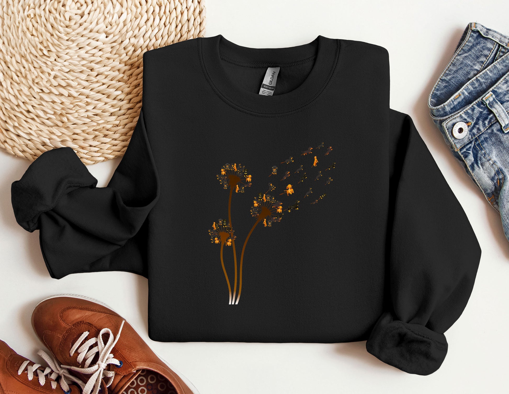 a black sweatshirt with yellow flowers on it