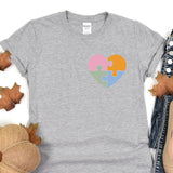 a t - shirt with a puzzle heart on it