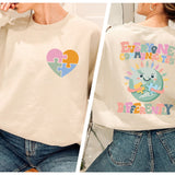 a woman wearing a sweatshirt with a heart on it