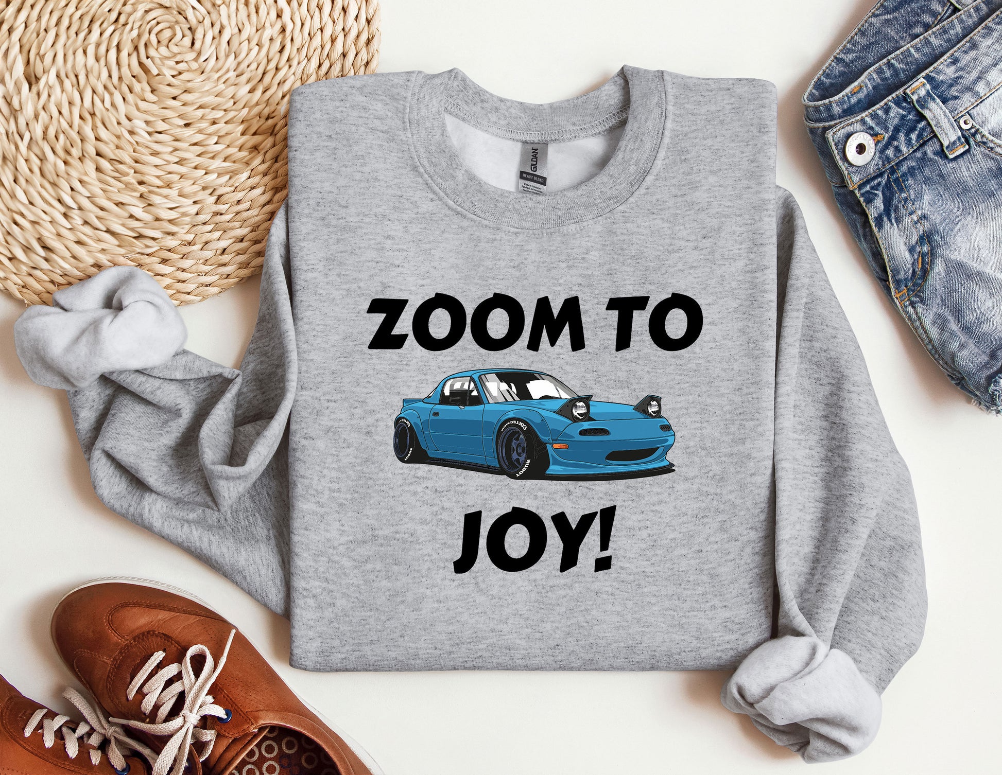 a blue car with the words zoom to joy on it