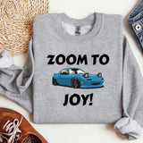 a blue car with the words zoom to joy on it