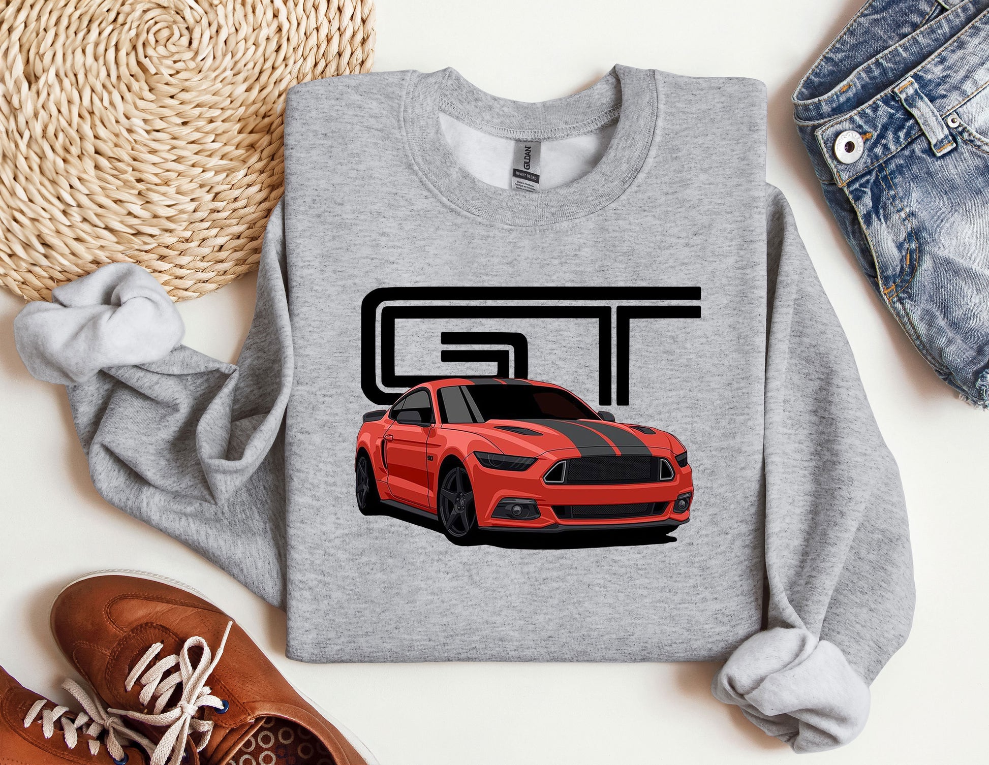 a gray sweatshirt with a red mustang on it