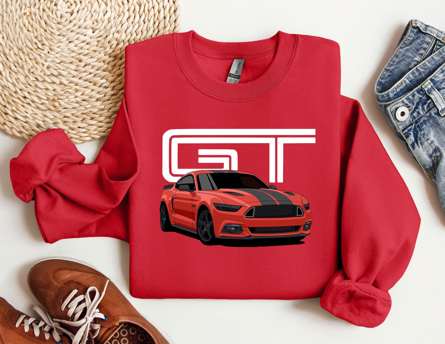 a red sweatshirt with a picture of a mustang on it