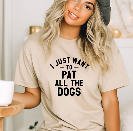 a woman wearing a t - shirt that says i just want to pat all the