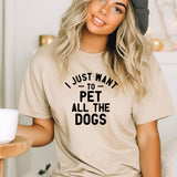a woman wearing a t - shirt that says i just want to pet all the